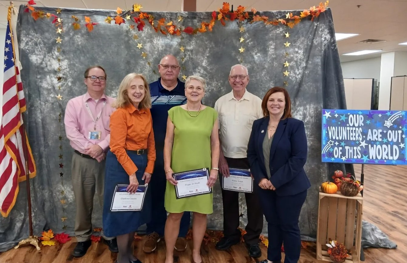 Volunteers of Clarion County were recognized on Friday afternoon at an AmeriCorps Seniors RSVP luncheon held at the Trinity Point Church of God. [Pictured above: Charlene Cousins, Peggy Jo Staab (front, left to right), and Harry Nulph (back right) were honored for their total years of service and were presented with certificates from State Representative Donna Oberlander and Clarion County Commissioners Wayne Brosious and Ed Heasley.